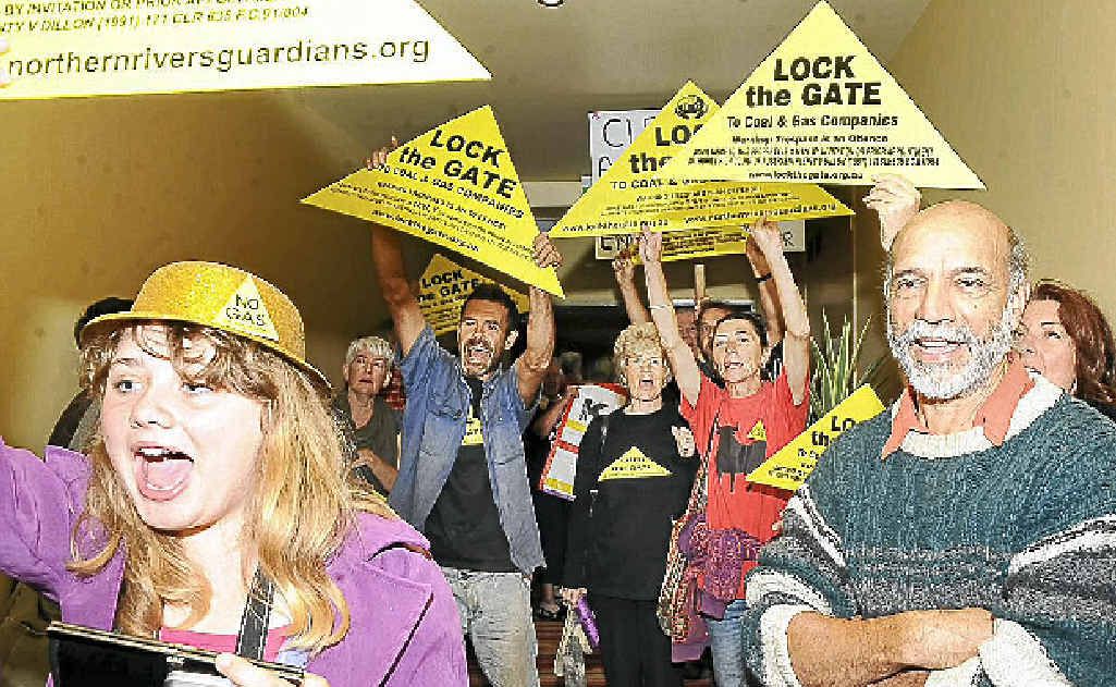 Coal-seam gas protesters outside the meeting room at the Lismore Workers Club. Coal-seam gas protesters outside the meeting room at the Lismore Workers Club.