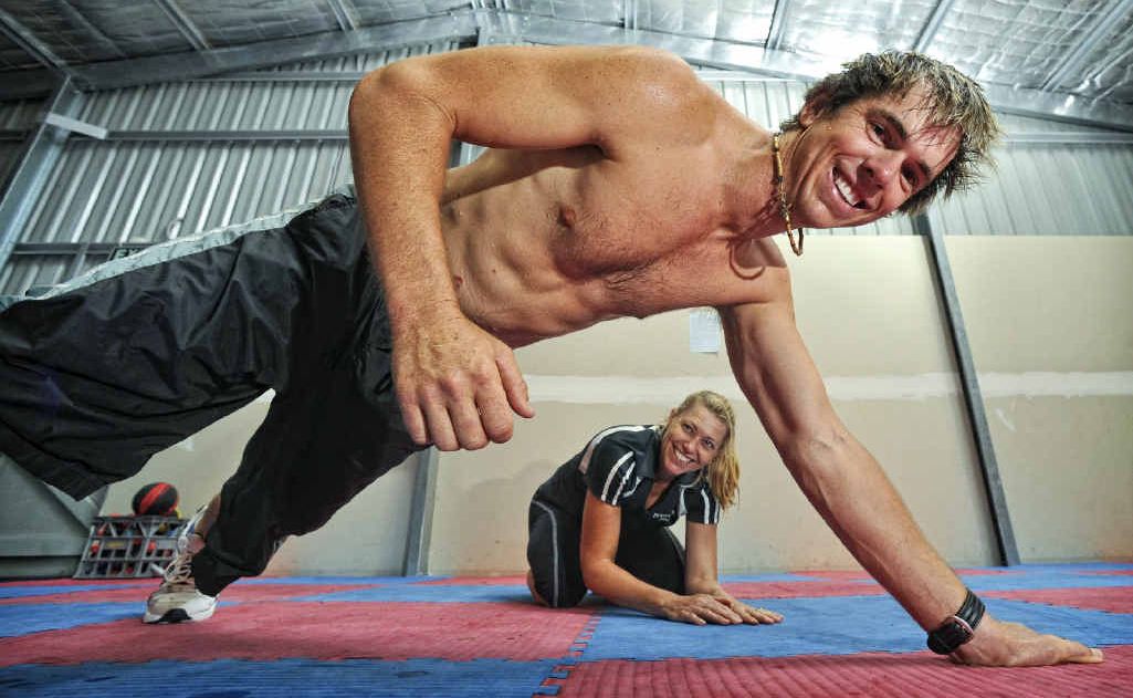Bodyrock Fitness trainer John Causley (front) and Bodyrock Fitness owner Regina Griffiths get warmed up for John’s attempt at 500 one-handed pushes to raise money for charity. Bodyrock Fitness trainer John Causley (front) and Bodyrock Fitness owner Regina Griffiths get warmed up for John’s attempt at 500 one-handed pushes to raise money for charity.