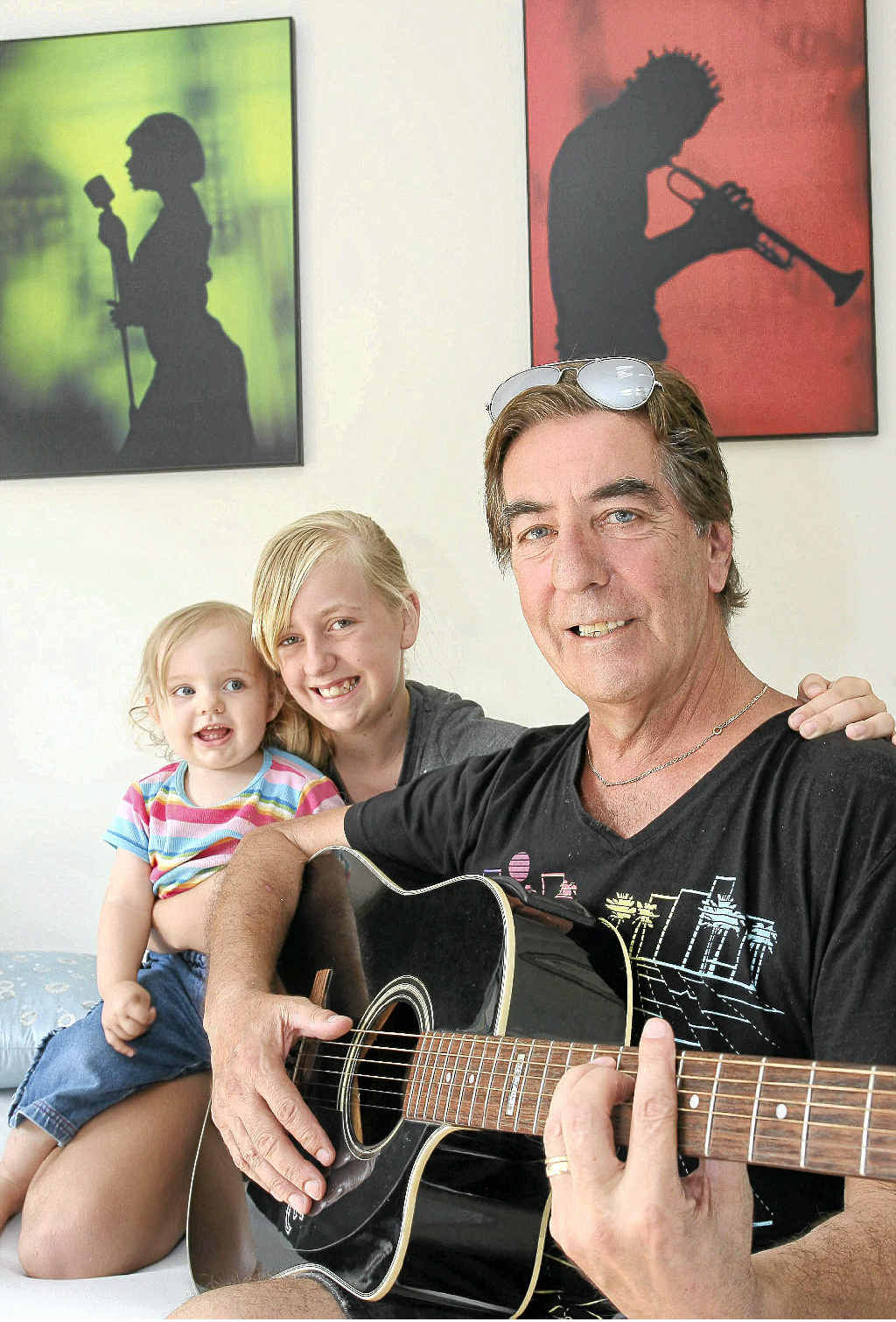 Musician Mikey St Clair and two of his daughters Bella Rose, 16 months, and Lara, 11. Musician Mikey St Clair and two of his daughters Bella Rose, 16 months, and Lara, 11.