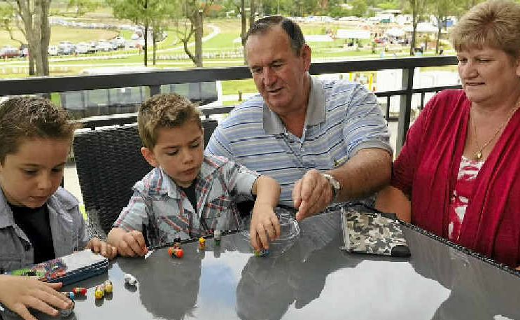 Taking a break from photos at their new home on the hill are (from left) Liam and Lachlan Foyle and grandparents John and Kathy Mahon. Taking a break from photos at their new home on the hill are (from left) Liam and Lachlan Foyle and grandparents John and Kathy Mahon.