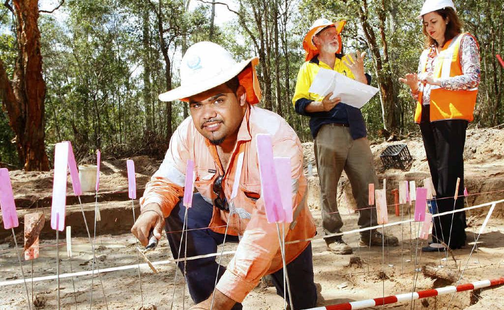 Cultural Heritage officer Richard Bonner (front) working at an archeological site where the new Richlands to Springfield train line is being constructed. Also pictured is archeologist Michael Strong and Transport Minister Annastacia Palaszczuk MP. Cultural Heritage officer Richard Bonner (front) working at an archeological site where the new Richlands to Springfield train line is being constructed. Also pictured is archeologist Michael Strong and Transport Minister Annastacia Palaszczuk MP.