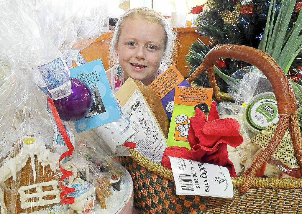 Sari Conti, whose great grandparents were Hunchy (near Palmwoods) pineapple farmers, enjoys the family fun of making a gift hamper at the Big Pineapple Growers and Fine Food Markets. Sari Conti, whose great grandparents were Hunchy (near Palmwoods) pineapple farmers, enjoys the family fun of making a gift hamper at the Big Pineapple Growers and Fine Food Markets.