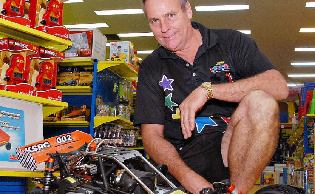 John Meneo, owner of Toyworld at Northpoint Retail, Mackay, with a one-fifth scale, off-road Baja buggy, one of the best-selling toys this year. John Meneo, owner of Toyworld at Northpoint Retail, Mackay, with a one-fifth scale, off-road Baja buggy, one of the best-selling toys this year.