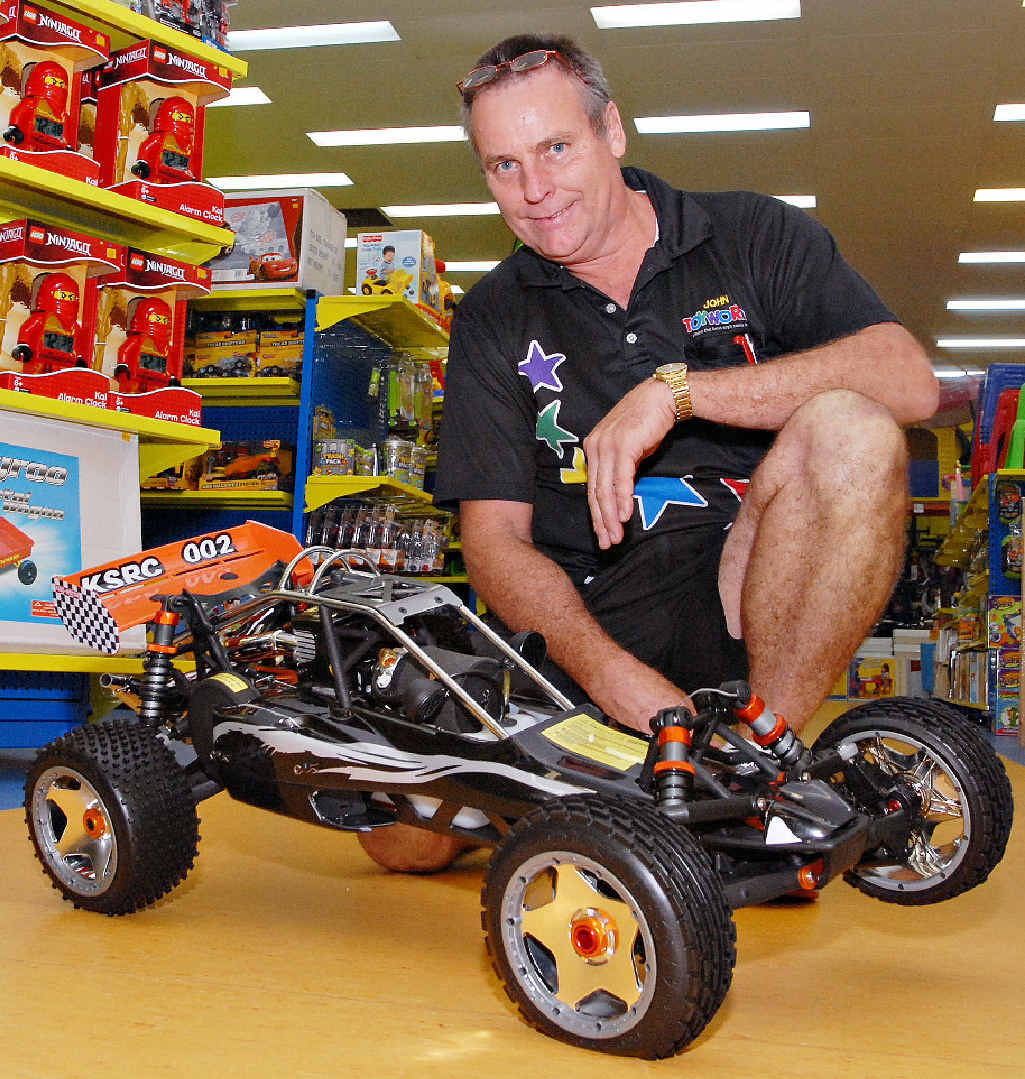 John Meneo, owner of Toyworld at Northpoint Retail, Mackay, with a one-fifth scale, off-road Baja buggy, one of the best-selling toys this year. John Meneo, owner of Toyworld at Northpoint Retail, Mackay, with a one-fifth scale, off-road Baja buggy, one of the best-selling toys this year.