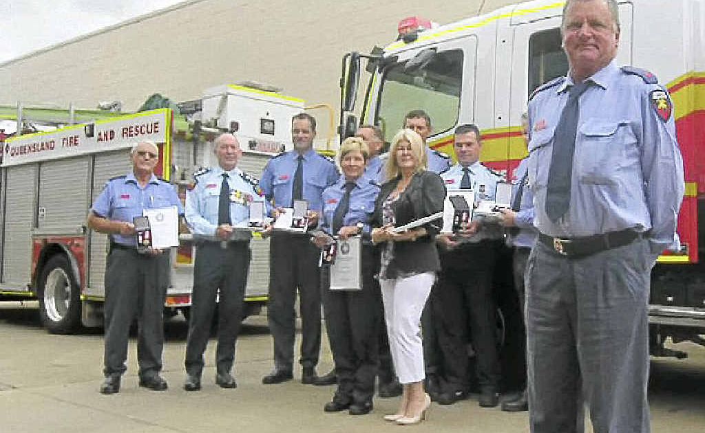 Gin Gin auxiliary firefighter David Sinden and the eight other recipients of medals at a special service on Friday. Gin Gin auxiliary firefighter David Sinden and the eight other recipients of medals at a special service on Friday.