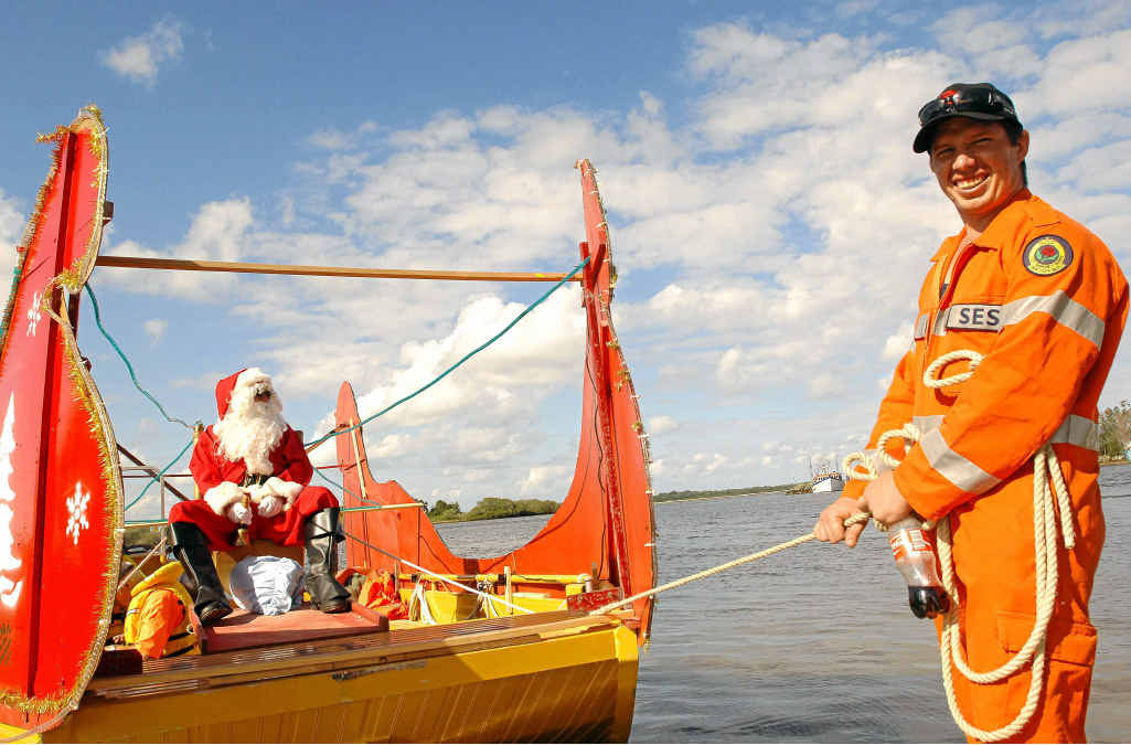 SES Santa waits for his six white boomers at Yamba on Friday. Holding the reigns is SES member Jeremy Partridge.