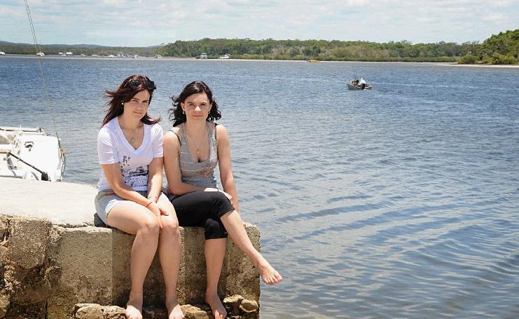 Tayla and Peta Comelli say they would miss dolphin feeding at Tin Can Bay if a ban goes ahead. Tayla and Peta Comelli say they would miss dolphin feeding at Tin Can Bay if a ban goes ahead.