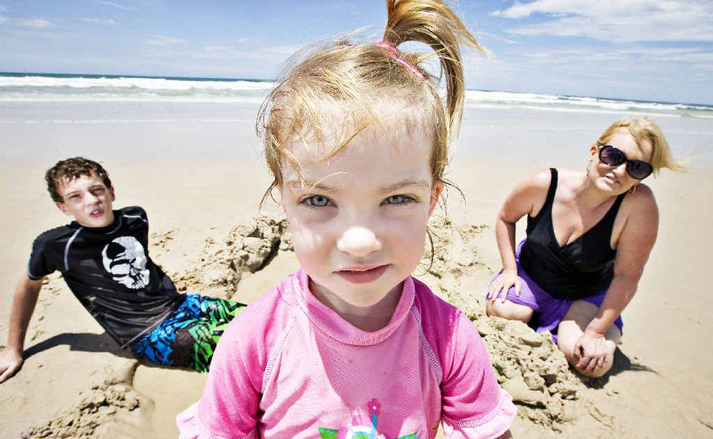 Nick Cooper, 13, Peyton, 3, and mother Anne-Maree Hauritz of Brisbane at South Ballina Beach yesterday. They say they adjust their behaviour at unpatrolled beaches. Nick Cooper, 13, Peyton, 3, and mother Anne-Maree Hauritz of Brisbane at South Ballina Beach yesterday. They say they adjust their behaviour at unpatrolled beaches.