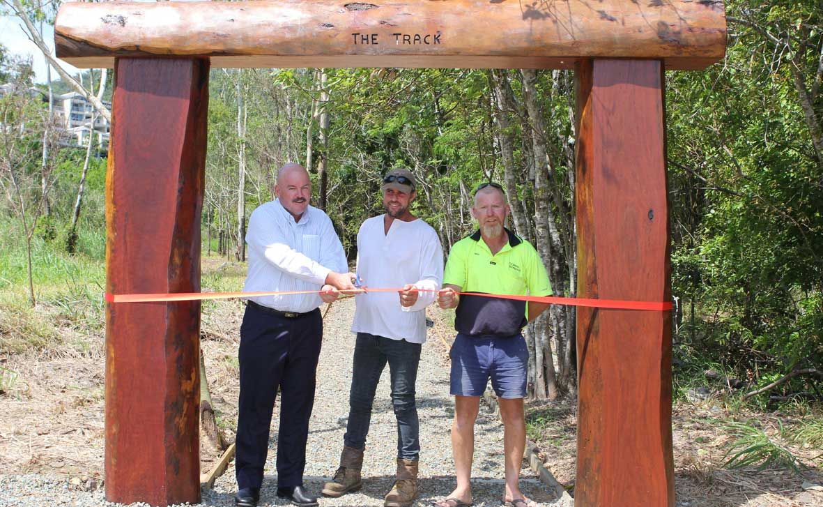 OPEN: Mayor Mike Brunker, craftsman Owen Bailey and contractor Troy O'Driscoll at the official ribbon cutting ceremnoy for the new Airlie Creek walking track last week. OPEN: Mayor Mike Brunker, craftsman Owen Bailey and contractor Troy O'Driscoll at the official ribbon cutting ceremnoy for the new Airlie Creek walking track last week.