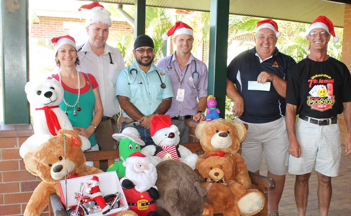 SPREADING CHEER: Whitsunday Toy Run organisers John Gurd and Dale Quinn (far right) with Proserpine Hospital staff Donna Martin, Dr Shaun Grimes, Dr Harbindar Singh and Christopher McMullen and the toys and cheques that were donated during the annual toy run on the weekend. Photo Aimee Vinci / Whitsunday Times SPREADING CHEER: Whitsunday Toy Run organisers John Gurd and Dale Quinn (far right) with Proserpine Hospital staff Donna Martin, Dr Shaun Grimes, Dr Harbindar Singh and Christopher McMullen and the toys and cheques that were donated during the annual toy run on the weekend. Photo Aimee Vinci / Whitsunday Times