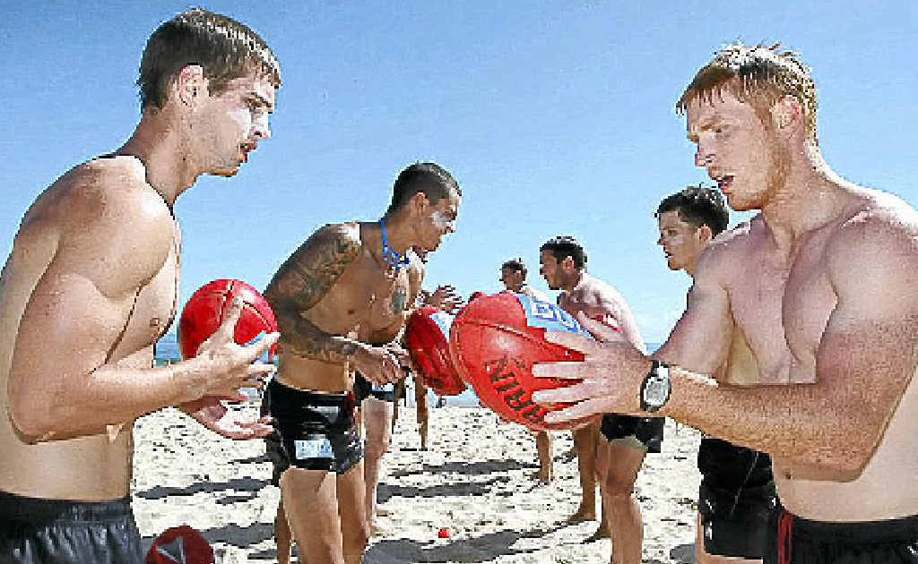 Hawthorn footballers practise handballs during a training session at Mooloolaba. Hawthorn footballers practise handballs during a training session at Mooloolaba.