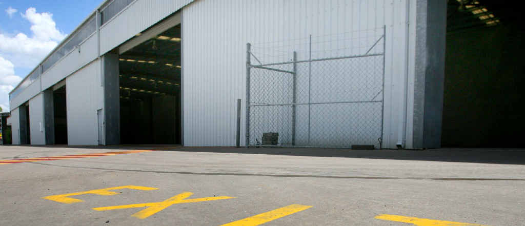Hyne Timber’s Power St warehouse lies empty after the company closed its Rockhampton operation. Hyne Timber’s Power St warehouse lies empty after the company closed its Rockhampton operation.
