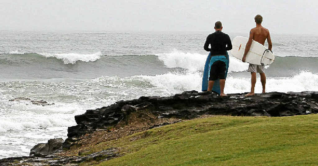 Surfers Dan Roe and Daniel Toms survey the storm surf at Mooloolaba Beach. Surfers Dan Roe and Daniel Toms survey the storm surf at Mooloolaba Beach.