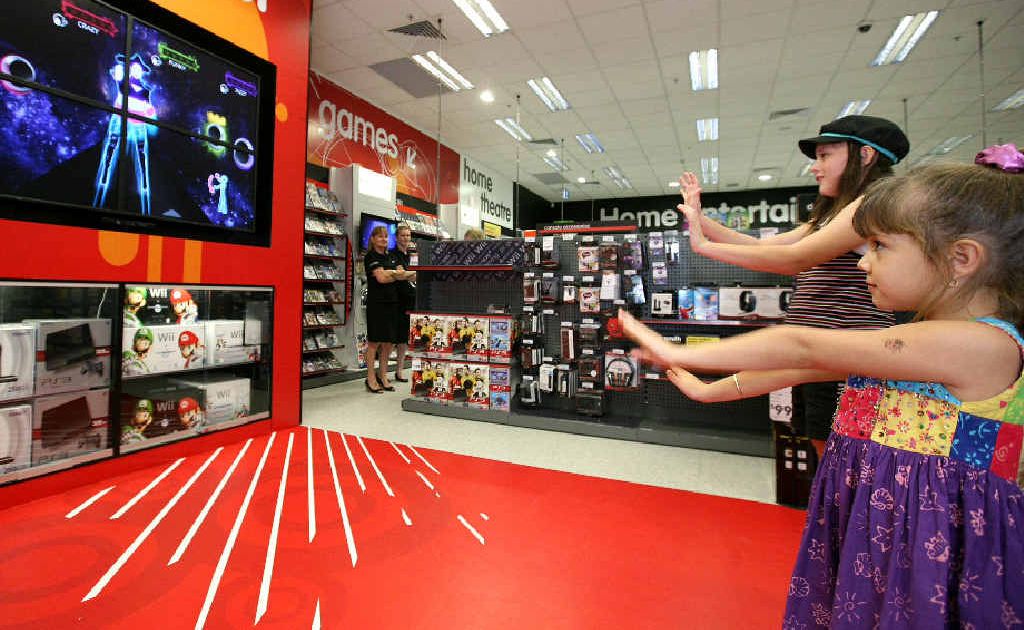 Sophie Reyes and Ana-Lucia Reyes (front) try out their moves with the X-Box Kinect at the Dick Smith store at Caneland Central. Sophie Reyes and Ana-Lucia Reyes (front) try out their moves with the X-Box Kinect at the Dick Smith store at Caneland Central.