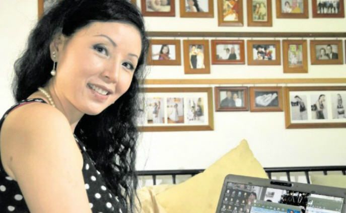 Phone Home: Gladstone resident Fei Matheson communicates with relatives and friends in China by using online technologies. Phone Home: Gladstone resident Fei Matheson communicates with relatives and friends in China by using online technologies.