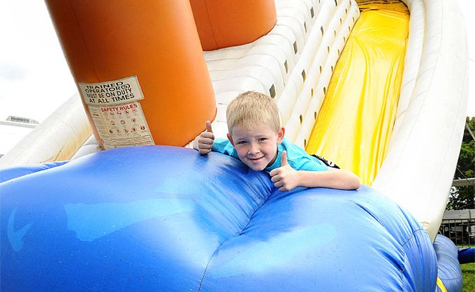 Six-year-old Tate Hawkins in having a lot of fun on the Titanic Slide, just one of the rides at Tin Can Bay tonight and tomorrow night.