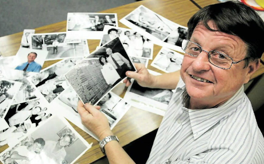 Reflection Time: Member for Rockhampton Rob Schwarten looks over photographs from early in his career from the files of The Morning Bulletin. 