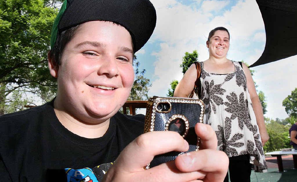 Ethan Mutzelberg, 13, from Rosewood has had a mobile phone for two years, and gets hand-me-down phones from mum Samantha Adams. Ethan Mutzelberg, 13, from Rosewood has had a mobile phone for two years, and gets hand-me-down phones from mum Samantha Adams.