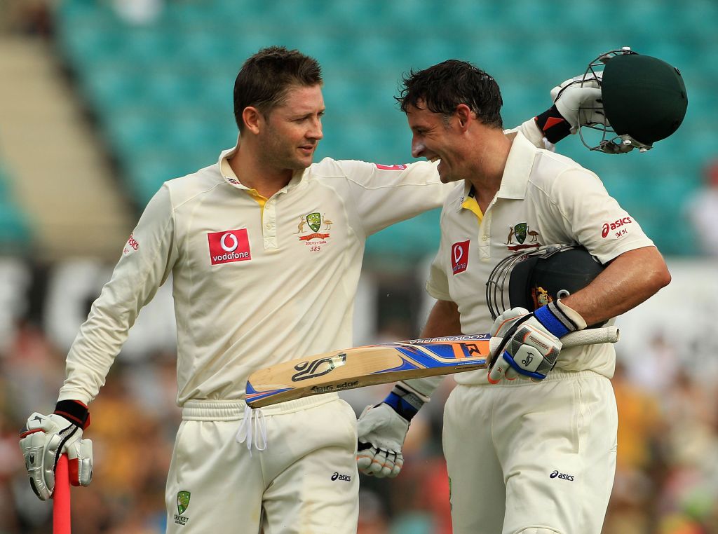 Michael Clarke of Australia hugs team mate Michael Hussey at the close of play during day two of the Second Test Match between Australia and India. Michael Clarke of Australia hugs team mate Michael Hussey at the close of play during day two of the Second Test Match between Australia and India.