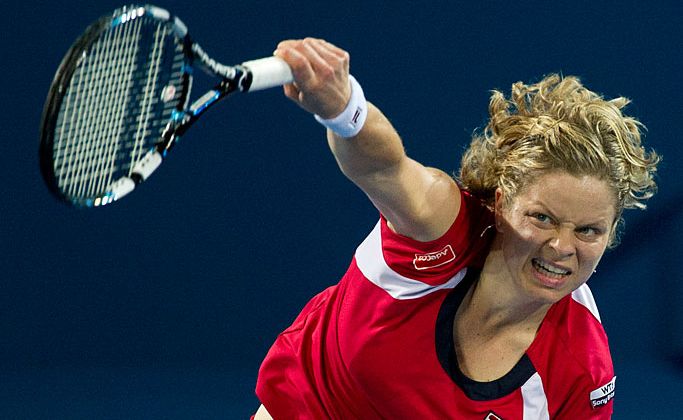 Kim Clijsters serves at the Brisbane International. Kim Clijsters serves at the Brisbane International.