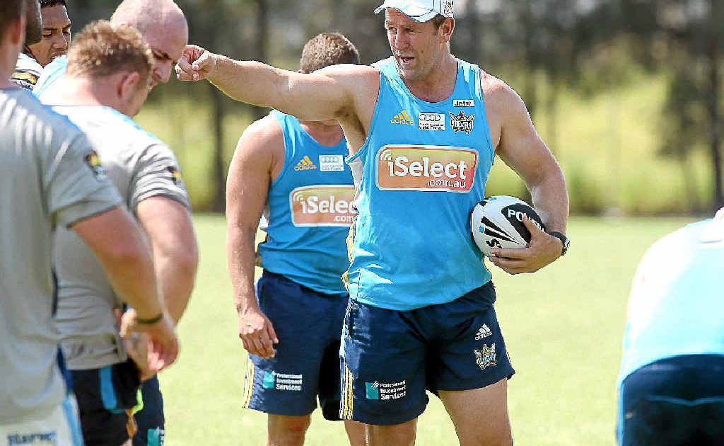 Gold Coast Titans coach John Cartwright issues instructions to his weary troops while they catch their breath during a sun-scorched training run. Gold Coast Titans coach John Cartwright issues instructions to his weary troops while they catch their breath during a sun-scorched training run.