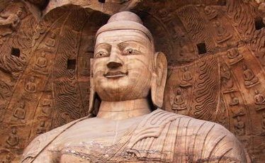 Buddhas survey their kingdom from windows carved out of sandstone.
Buddhas survey their kingdom from windows carved out of sandstone.