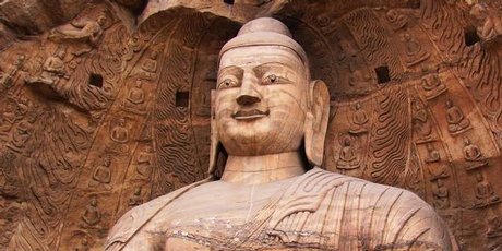 Buddhas survey their kingdom from windows carved out of sandstone.
Buddhas survey their kingdom from windows carved out of sandstone.