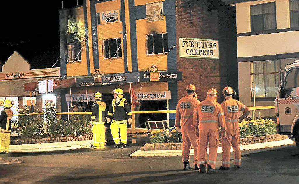 Emergency workers at the scene on Wednesday night outside the MacDade and Family store in Summerland Way, Kyogle. Emergency workers at the scene on Wednesday night outside the MacDade and Family store in Summerland Way, Kyogle.