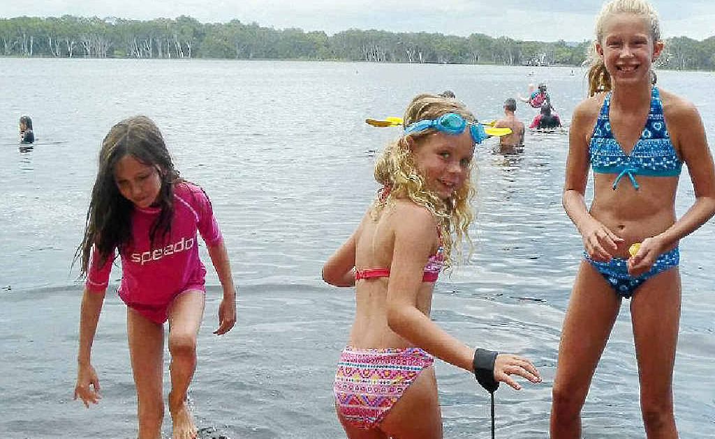 Ruby Clark, Amber Stewart and Tahlia Stewart swimming at Lake Ainsworth. Ruby’s mother Amanda Lake said all three girls began projectile vomiting within 24 hours of this photo being taken. Ruby Clark, Amber Stewart and Tahlia Stewart swimming at Lake Ainsworth. Ruby’s mother Amanda Lake said all three girls began projectile vomiting within 24 hours of this photo being taken.