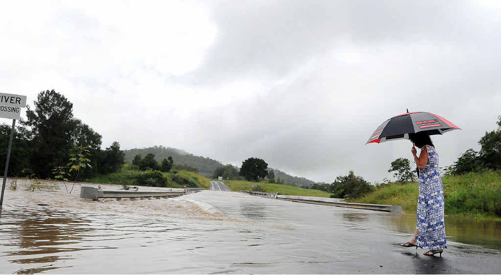 The Traveston Crossing Bridge was one of several cut by floodwaters in the region yesterday. The Traveston Crossing Bridge was one of several cut by floodwaters in the region yesterday.