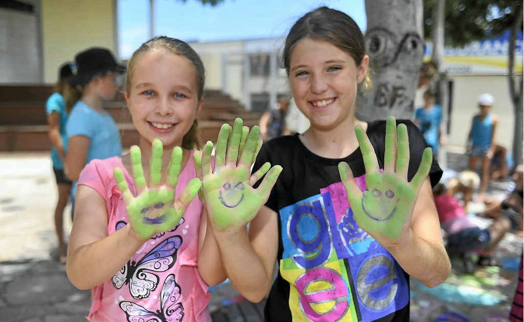 CHALK-TASTIC: Paige Hutchinson, 9 and Elizabeth Rodwell, 10 decorate themselves. CHALK-TASTIC: Paige Hutchinson, 9 and Elizabeth Rodwell, 10 decorate themselves.