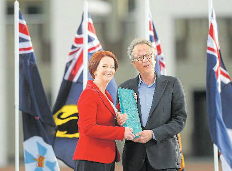 True Blue: Prime Minister Julia Gillard presents actor Geoffrey Rush with the Australian of the Year 2012 Award. 