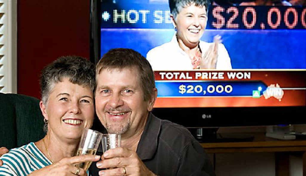 Chris Nicholls and husband Rob Schmaling celebrate their $20,000 win on Millionaire Hotseat. Chris Nicholls and husband Rob Schmaling celebrate their $20,000 win on Millionaire Hotseat.