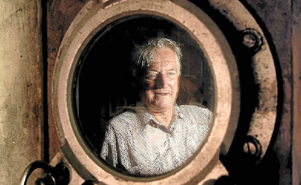 Ray Evans looks through a porthole from his vast collection. Ray Evans looks through a porthole from his vast collection.
