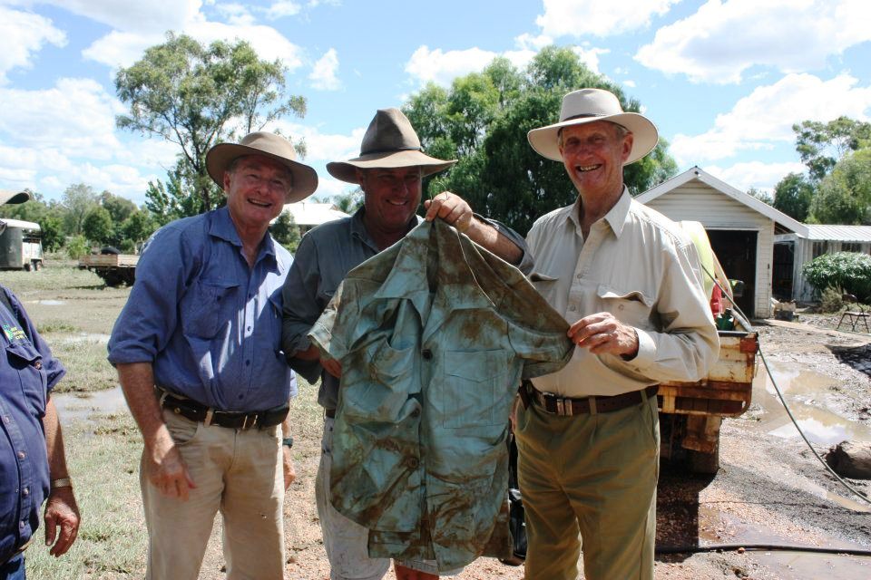 (from left) State Member for Warrego Howard Hobbs, resident Rob Cornish and Federal Member for Maranoa Bruce Scott inspect a flood-stained safari suit in Mitchell. (from left) State Member for Warrego Howard Hobbs, resident Rob Cornish and Federal Member for Maranoa Bruce Scott inspect a flood-stained safari suit in Mitchell.