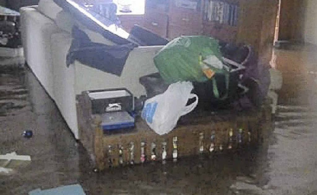 Furniture floats around as floodwaters enter a home at Corindi. Furniture floats around as floodwaters enter a home at Corindi.