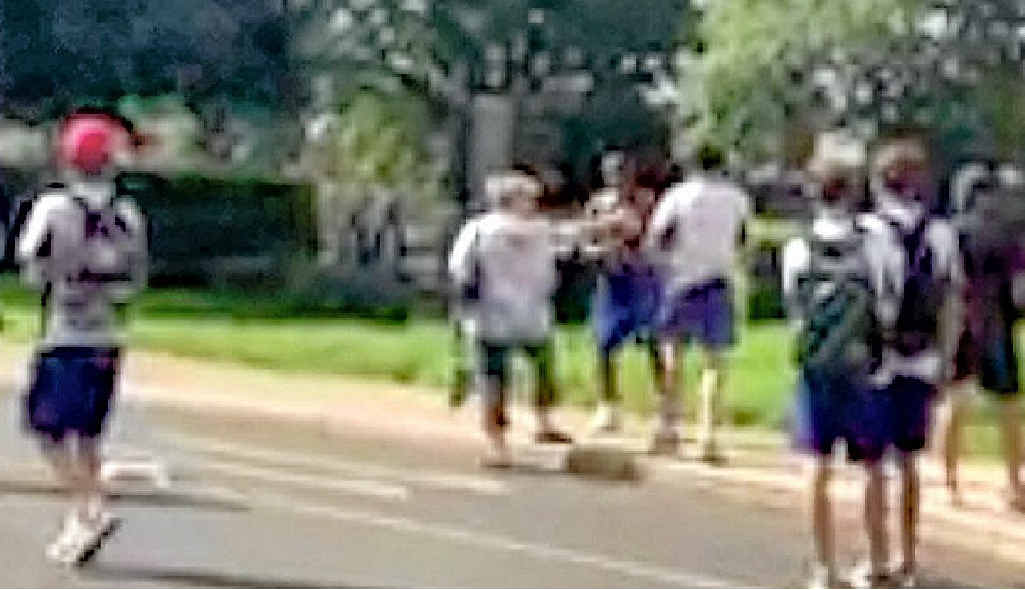 ONLINE VIOLENCE: A woman attempts to intervene in a fight between two Harristown State High School students while other students jeer and shout racial abuse. ONLINE VIOLENCE: A woman attempts to intervene in a fight between two Harristown State High School students while other students jeer and shout racial abuse.