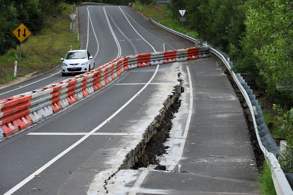 A section of the Old Pacific Highway, now Pine Creek Way, has collapsed and faces an extensive rebuild. A section of the Old Pacific Highway, now Pine Creek Way, has collapsed and faces an extensive rebuild.