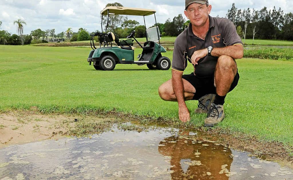 Oakwood Golf Club greenkeeper Wayne Stacpoole with a waterlogged bunker. Oakwood Golf Club greenkeeper Wayne Stacpoole with a waterlogged bunker.
