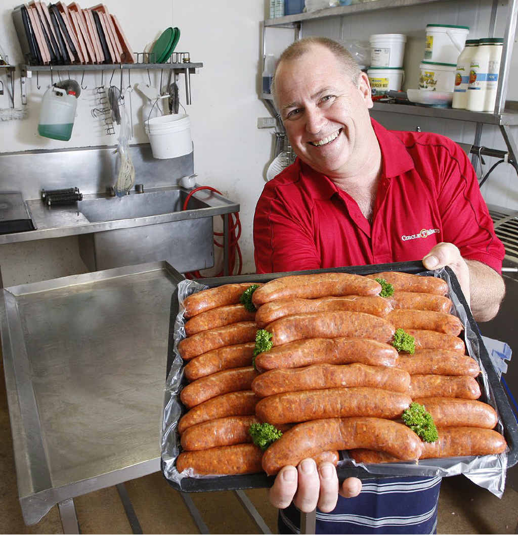 Owner of Circle T Meats Barnie Nolan with his award-winning sausages at his Raceview butcher shop. Owner of Circle T Meats Barnie Nolan with his award-winning sausages at his Raceview butcher shop.