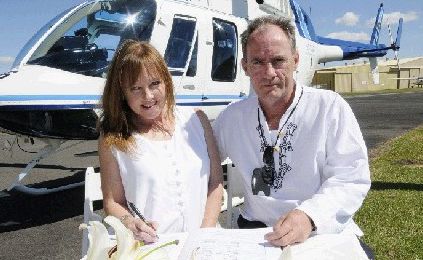 Julie and John Hill after they tied the knot the second time, at 500 feet above Byron Bay in a helicopter. Julie and John Hill after they tied the knot the second time, at 500 feet above Byron Bay in a helicopter.