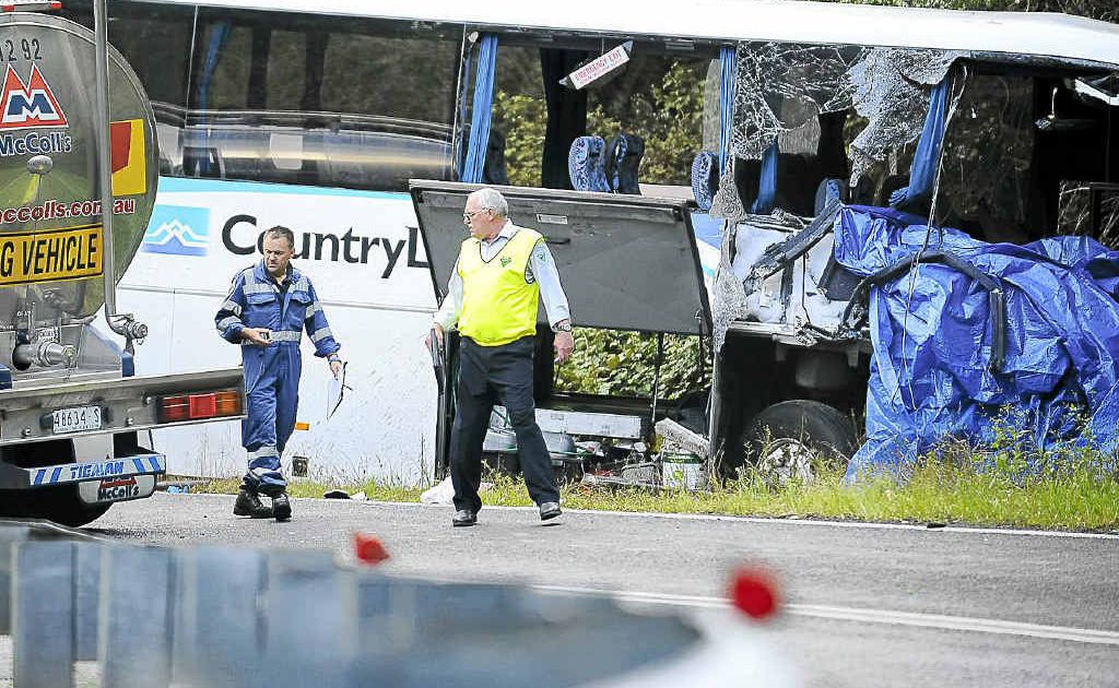 A B Double, empty McColl’s milk truck and a Countrylink bus collided on the Gwyder Highway halfway bewteen Grafton and Glen Innes on Friday afternoon. Pictured inspecting the damaged vehicles are RMS Inspector and RMS Area Manager Neil Henwood. Photo: Debrah Novak/The Daily Examiner A B Double, empty McColl’s milk truck and a Countrylink bus collided on the Gwyder Highway halfway bewteen Grafton and Glen Innes on Friday afternoon. Pictured inspecting the damaged vehicles are RMS Inspector and RMS Area Manager Neil Henwood. Photo: Debrah Novak/The Daily Examiner