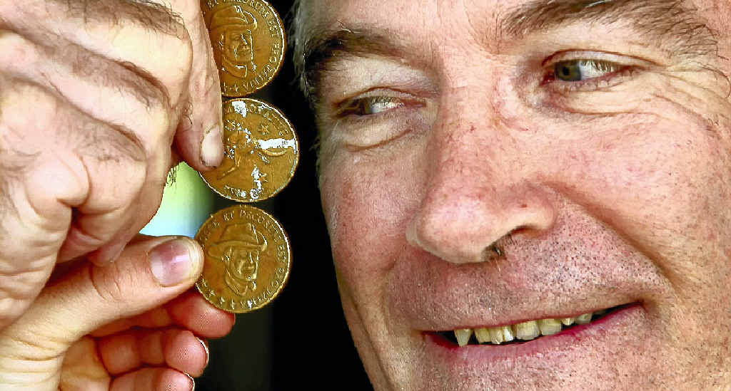 Murwillumbah Services Memorial Club assistant manager Paul Murphy with pennies used to play two-up at the club on Anzac Day. Murwillumbah Services Memorial Club assistant manager Paul Murphy with pennies used to play two-up at the club on Anzac Day.