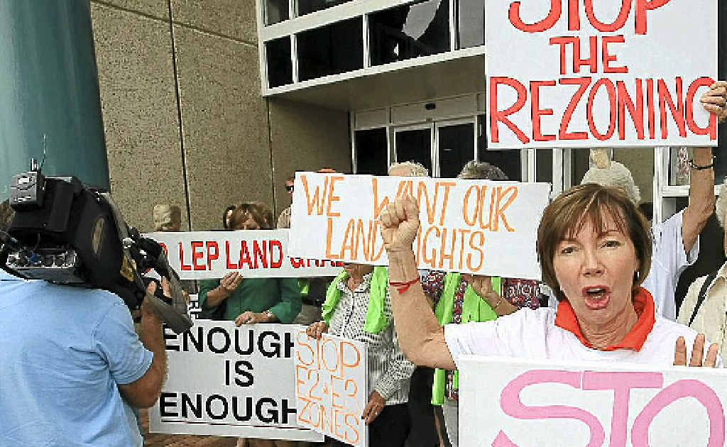 Rikki Grinberg of the Ballina Ratepayers’ Association leads the protest outside Ballina Council Chambers. Rikki Grinberg of the Ballina Ratepayers’ Association leads the protest outside Ballina Council Chambers.