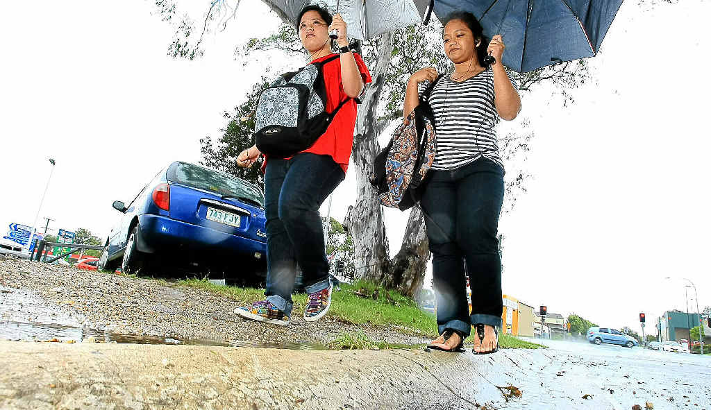 Sisters and Banora Point residents Jaydel and Jaycel Bujawe had to walk home in the rain. Sisters and Banora Point residents Jaydel and Jaycel Bujawe had to walk home in the rain.