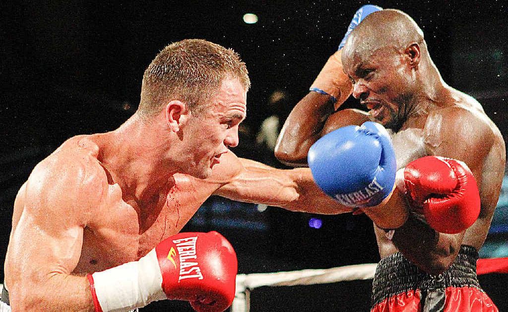 Hervey Bay’s Jarrod Fletcher lands a big left on former Australian middleweight champion Johannes Mwetupunga during their showdown in Melbourne on Friday night. Fletcher won the bout on a unanimous points decision. Hervey Bay’s Jarrod Fletcher lands a big left on former Australian middleweight champion Johannes Mwetupunga during their showdown in Melbourne on Friday night. Fletcher won the bout on a unanimous points decision.