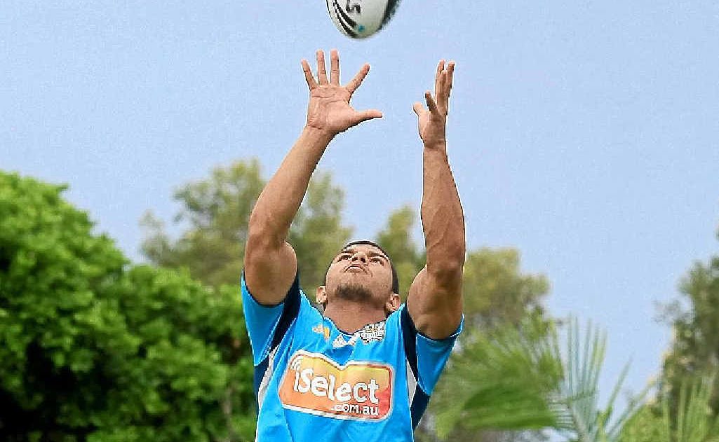 Gold Coast Titans winger David Mead leaps for a high ball during a training run at Ballina. Gold Coast Titans winger David Mead leaps for a high ball during a training run at Ballina.