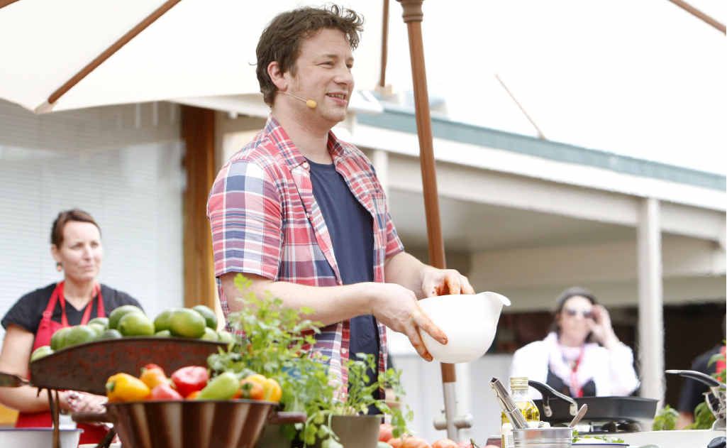 Celebrity chef Jamie Oliver gives a live cooking demonstration during his visit to Ipswich on Saturday. Celebrity chef Jamie Oliver gives a live cooking demonstration during his visit to Ipswich on Saturday.