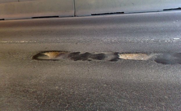 Jamie Bartley photographed the potholes that he drove over. Jamie Bartley photographed the potholes that he drove over.