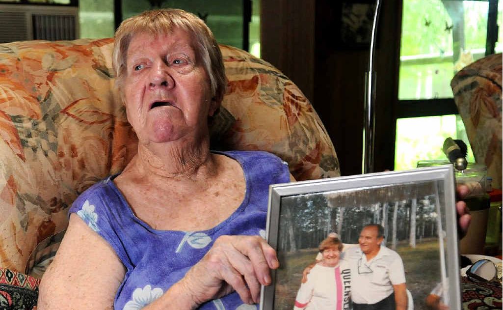 MEMORIES: Aileen Duffell shows a picture of herself and her lost husband Fred who drowned after his car (left) left the road on a causeway on Arborten Rd at Glenwood. MEMORIES: Aileen Duffell shows a picture of herself and her lost husband Fred who drowned after his car (left) left the road on a causeway on Arborten Rd at Glenwood.